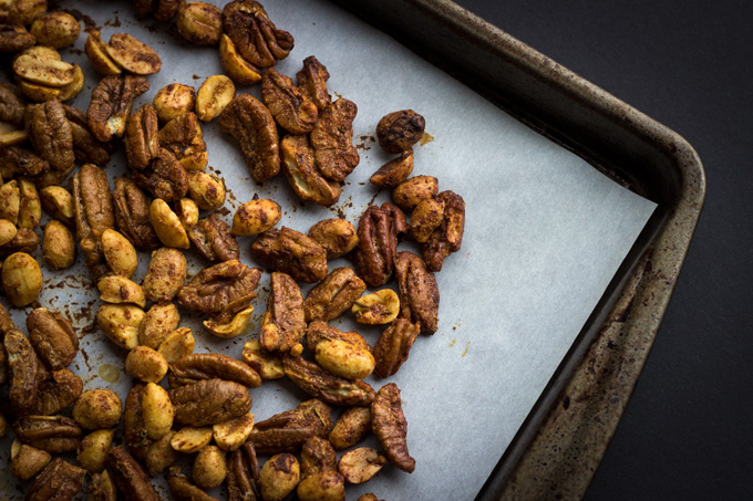 Corner of sheet pan zoomed in on Cracker Jacks Remix with white parchment paper and black backgrounf